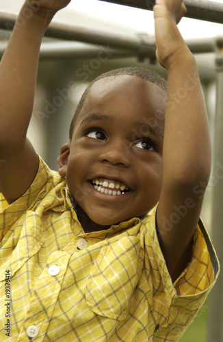 Photo: African American boy on playground African American boy on playground