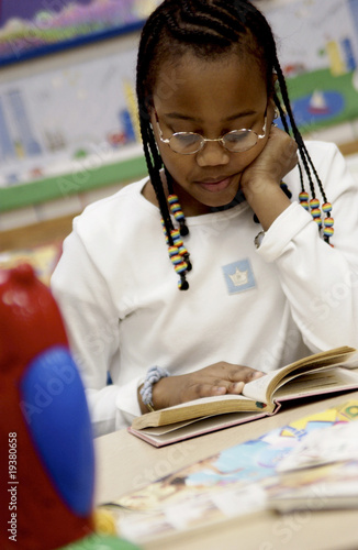 Photo: Child reading in class Child reading in class