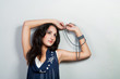 cute dark haired girl shaped standing relaxing with beads