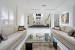 Luxurious living room with grand entrance in the background