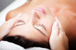 Foto: Beautiful young woman receiving facial massage. Beautiful young woman receiving facial massage.