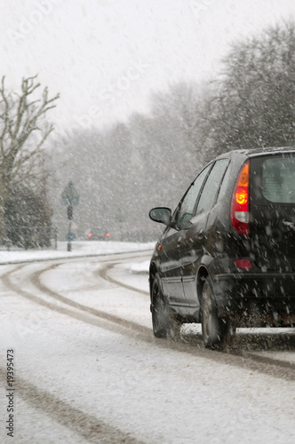 Photo: vehicle driving on a snowy highway vehicle driving on a snowy highway