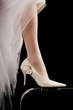 Dress and shoe of the bride.