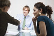 Three Businesspeople in Meeting