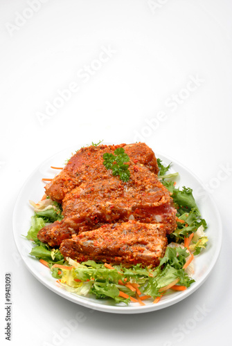 Photo: some marinated organic rib on healthy salad some marinated organic rib on healthy salad