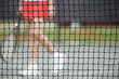 Senior woman at the tennis net