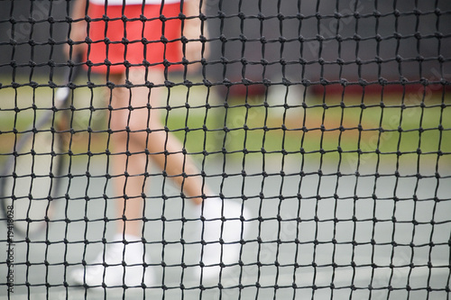 Photo: Senior woman at the tennis net Senior woman at the tennis net