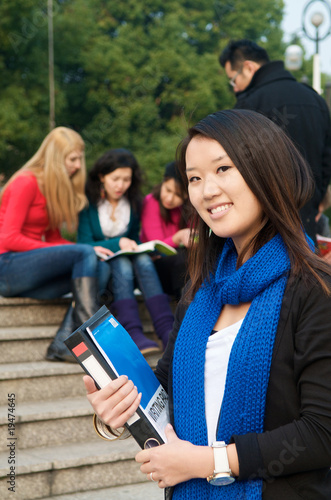 Photo: Asian Student with Notebook Asian Student with Notebook