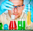Young scientist in laboratory with test tubes