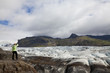 Woman Hiker Looking Across The Vatnajokull Glacier Iceland