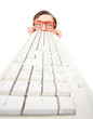 Foto: Funny guy hiding behind a computer keyboard Funny guy hiding behind a computer keyboard