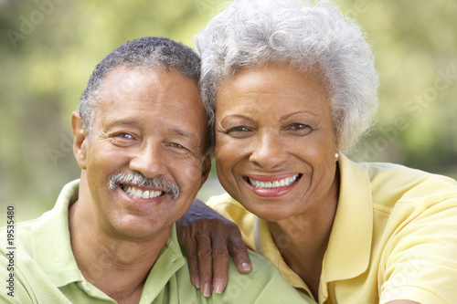 Photo: Portrait Of Senior Couple In Park Portrait Of Senior Couple In Park