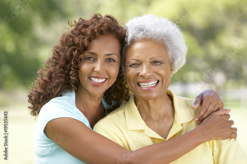 Photo: Senior Woman With Adult Daughter In Park Senior Woman With Adult Daughter In Park