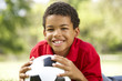 Boy In Park With Football