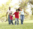 Family Enjoying Walk In Park