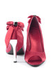 Red women high heel shoes closeup over white
