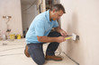 Electrician Installing Wall Socket