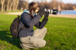 Photographer taking picture. Outdoor