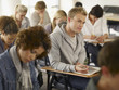 College students taking test in classroom