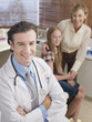 Doctor with patient and her mother in doctor?s office