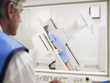 Technician giving patient x-ray