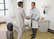Doctor greeting patient in hospital room