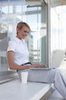 Young businesswoman with a computer