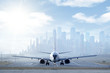 Big aircraft on runway in big city