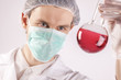 Scientist holding Flask witch Red Fluid