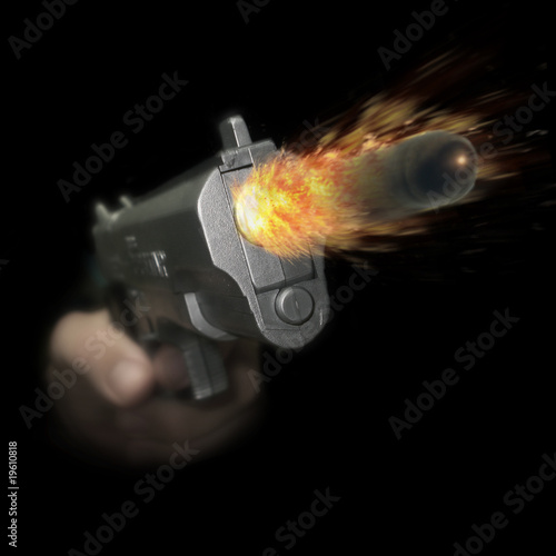 Photo: Firing a Handgun Firing a Handgun