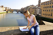 Woman looking the map at Florence, Italy