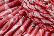 Cutting sausage and cured meat on a celebratory table