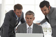 Businessmen with a computer