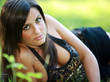 Braless Busty young girl lays down on meadow cleavage