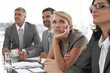 Young woman bored at a meeting