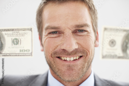 Photo: Happy man with dollar notes Happy man with dollar notes