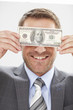 Young man with a dollar note