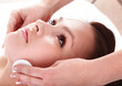 Beautiful young woman in spa. Facial massage.