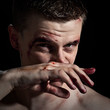 Man wiping blood Man wiping blood