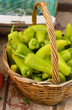 Basket of fresh green peppers at market