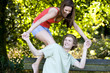 A young couple having fun on a park bench