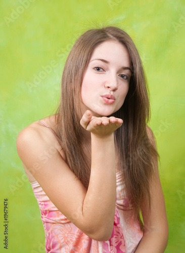 Photo: Air-kissing long-haired teen girl Air-kissing long-haired teen girl