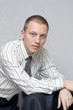 Young businessman looking thoughtfully into the distance.