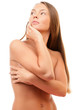 Woman covering breast looking away