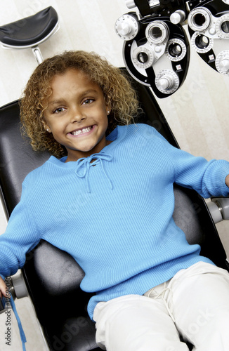 Photo: African American girl getting eye exam African American girl getting eye exam
