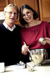 Photo: Couple cooking in kitchen Couple cooking in kitchen