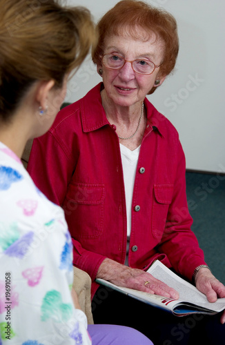 Photo: Nurse talking with senior woman Nurse talking with senior woman