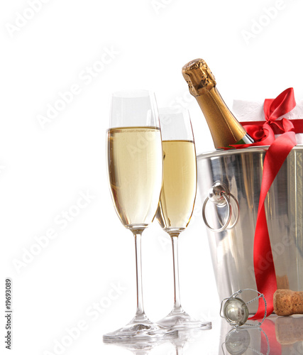 Photo: Glasses of champagne with red ribbon gift Glasses of champagne with red ribbon gift
