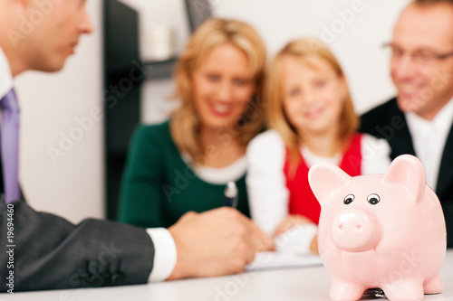 Photo: Family with consultant - finance and insurance Family with consultant - finance and insurance