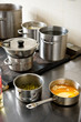 Ladle with melted butter on commercial kitchen